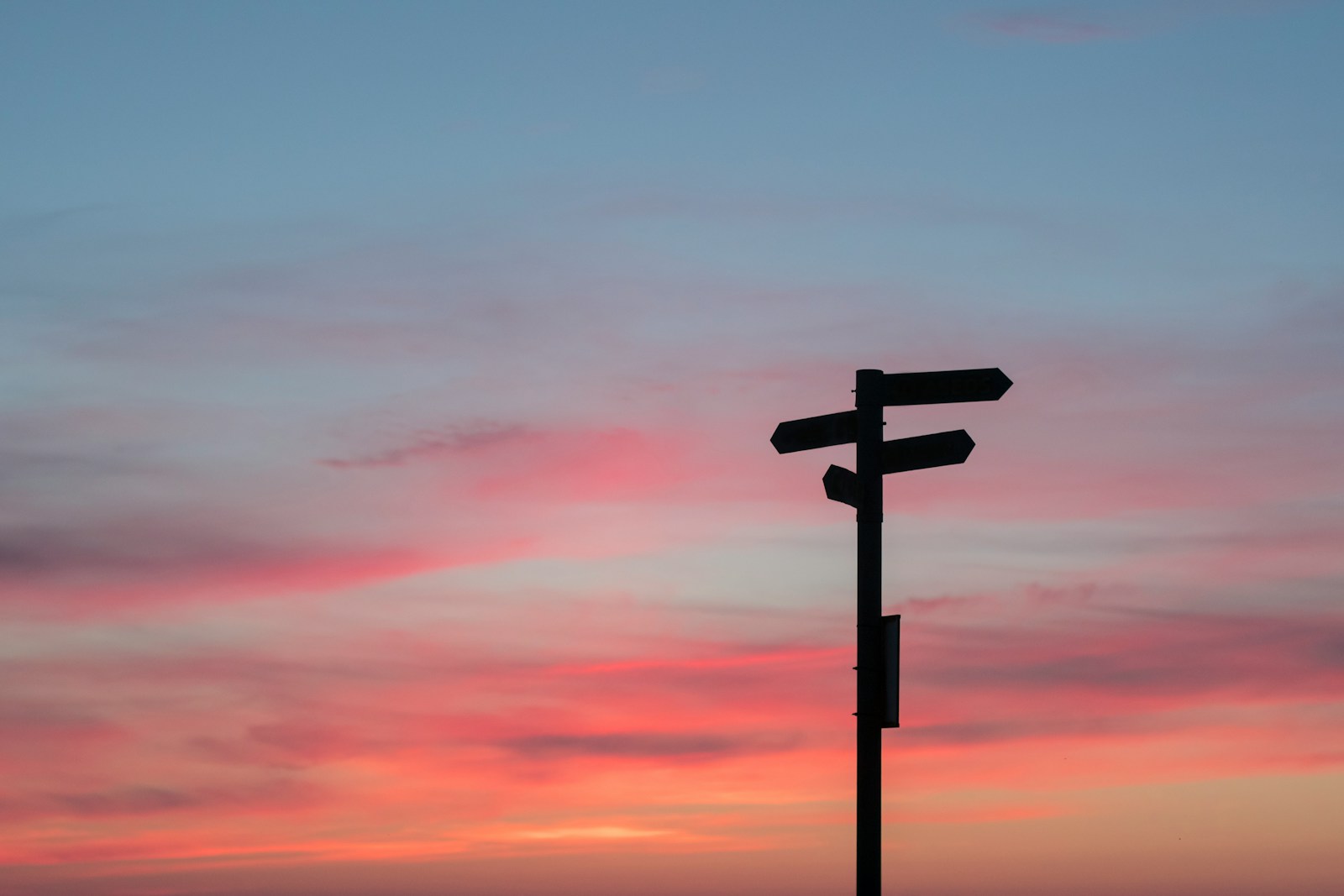 Photo by Javier Allegue Barros silhouette of road signage during golden hour