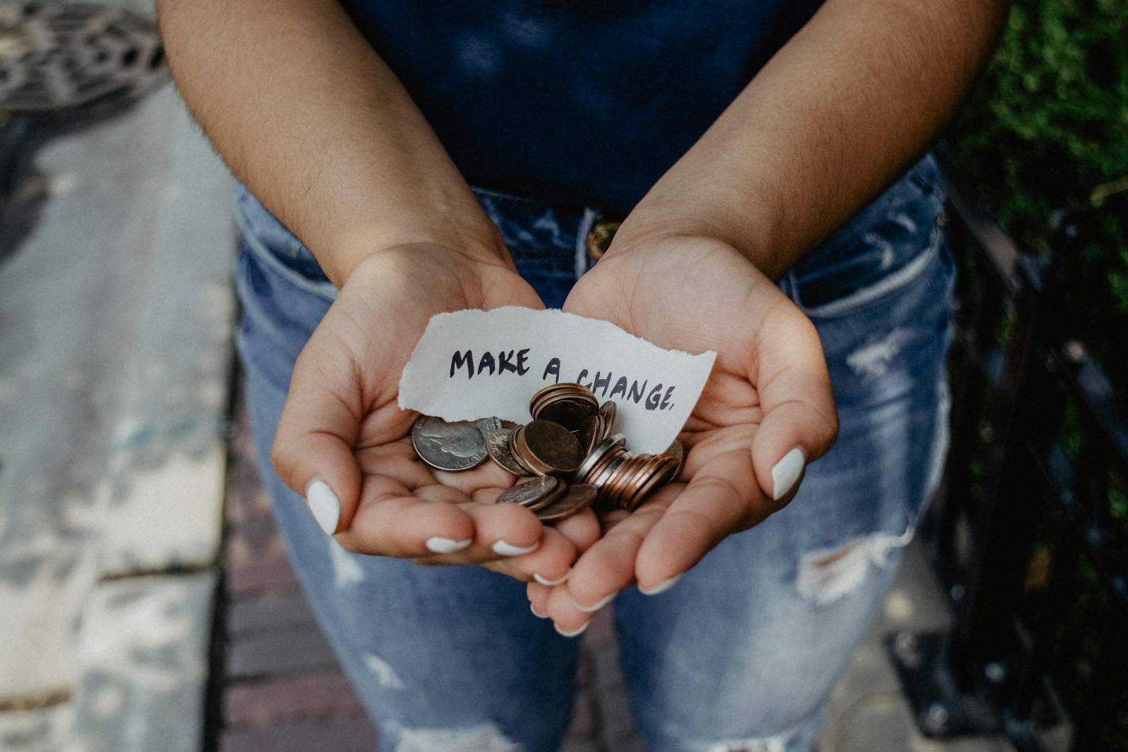 Photo by Katt Yukawa person showing both hands with make a change note and coins